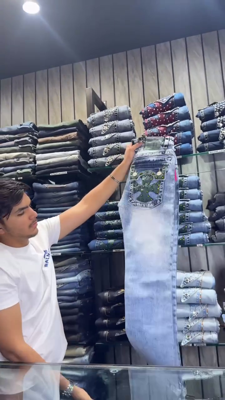 Bold Detail, Classic Denim: Men’s Blue Jeans with Green & Studded Back Pockets