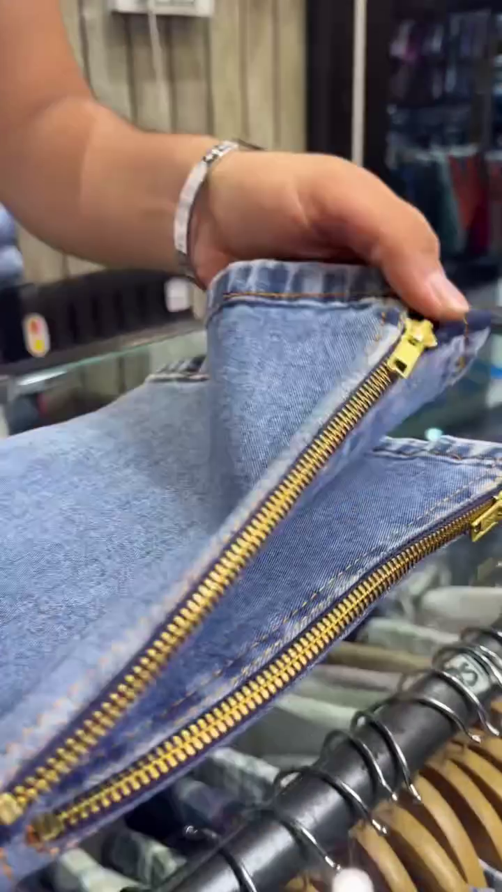 Bold Detail, Classic Denim: Men’s Blue Jeans with Green & Studded Back Pockets