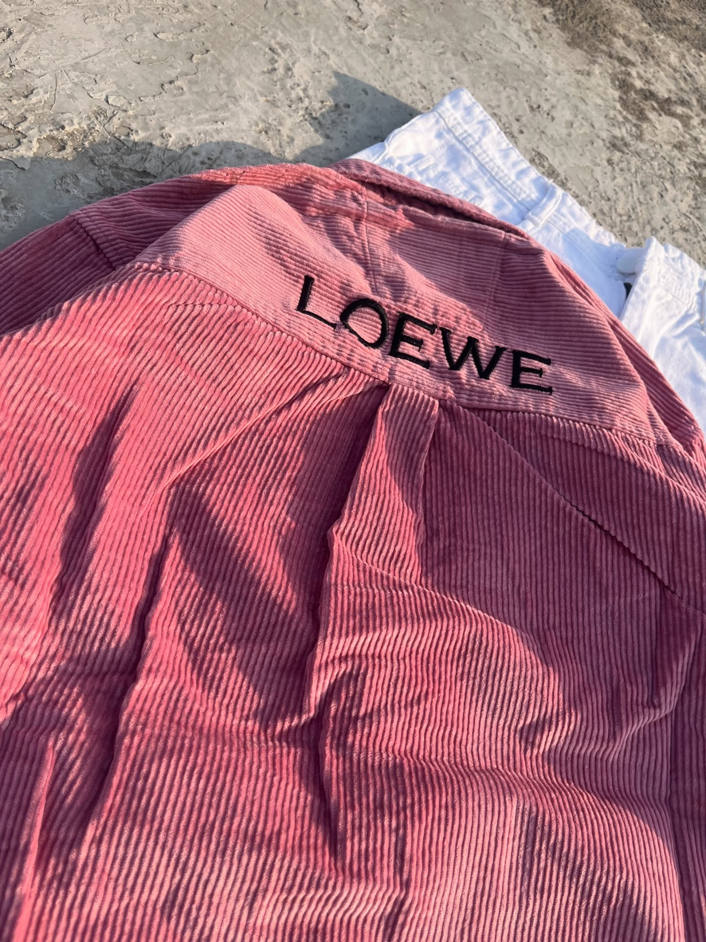 Bold & Contemporary: Red Corduroy Loewe Overshirt with White Pants