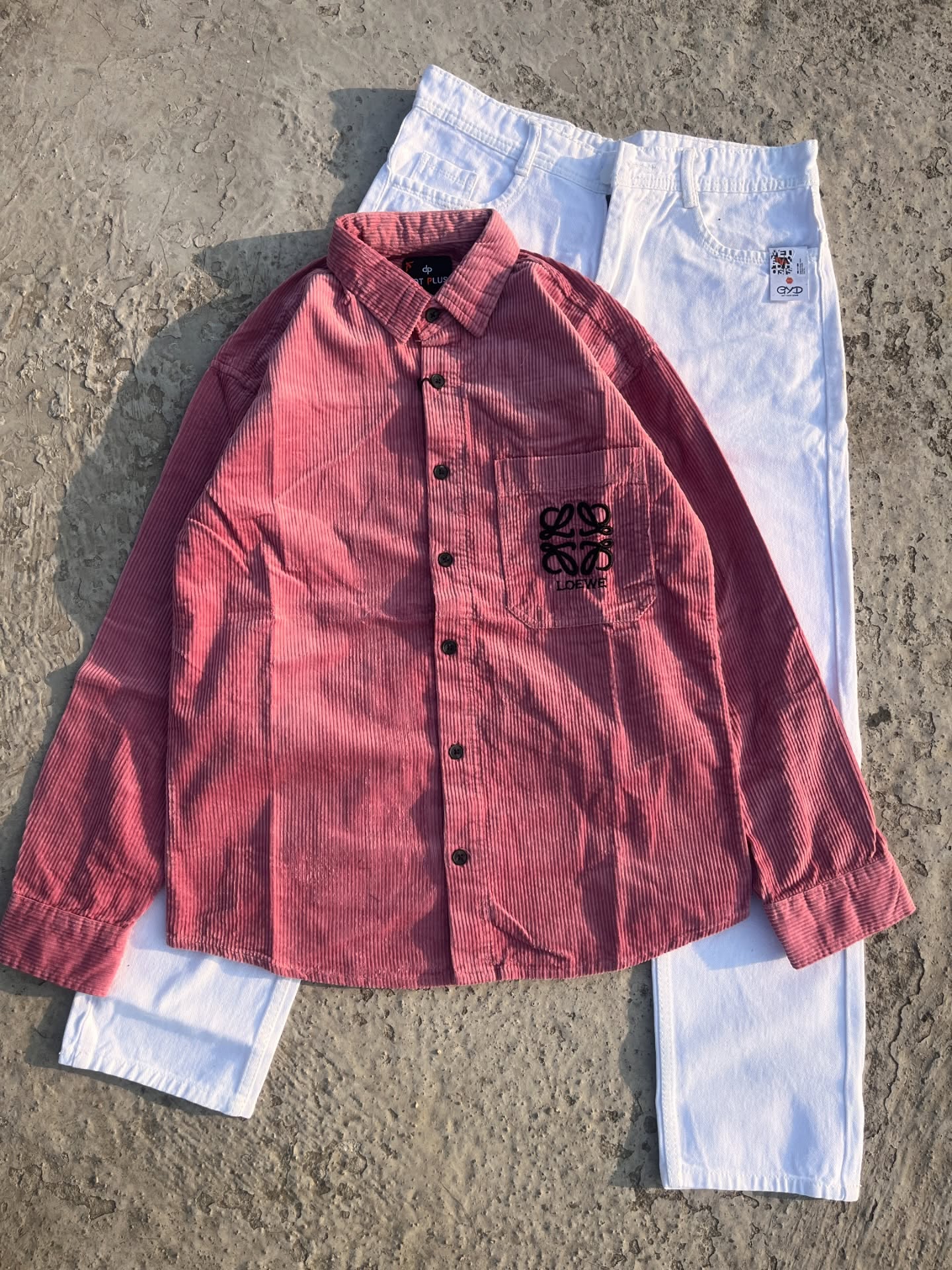 Bold & Contemporary: Red Corduroy Loewe Overshirt with White Pants