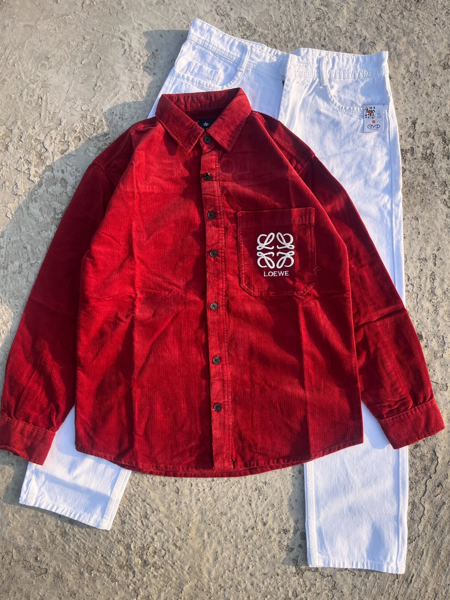 Bold & Contemporary: Red Corduroy Loewe Overshirt with White Pants