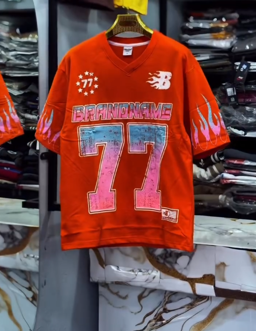 Bold Street Energy: Turquoise V-Neck Jersey with “77” Graphic and Pink Flame Accents