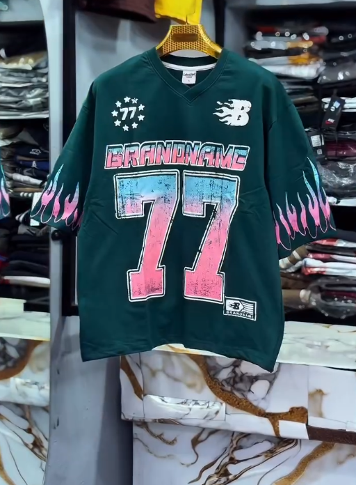 Bold Street Energy: Turquoise V-Neck Jersey with “77” Graphic and Pink Flame Accents