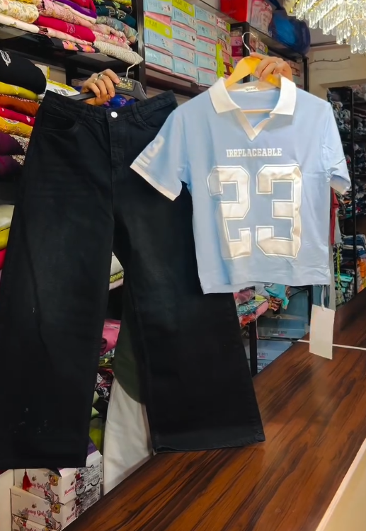 Bold Streetwear: Red & White Collared T-Shirt with “IRRPLACEABLE 23” and Black Wide-Leg Jeans