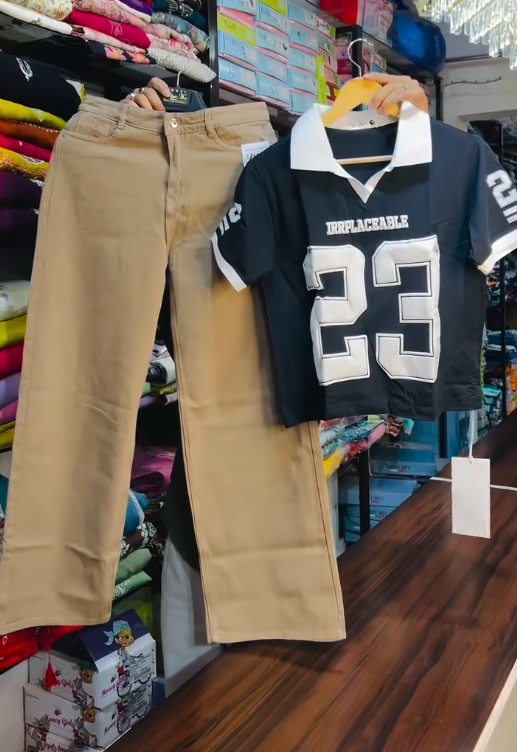 Bold Streetwear: Red & White Collared T-Shirt with “IRRPLACEABLE 23” and Black Wide-Leg Jeans