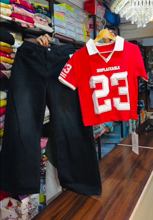 Bold Streetwear: Red & White Collared T-Shirt with “IRRPLACEABLE 23” and Black Wide-Leg Jeans