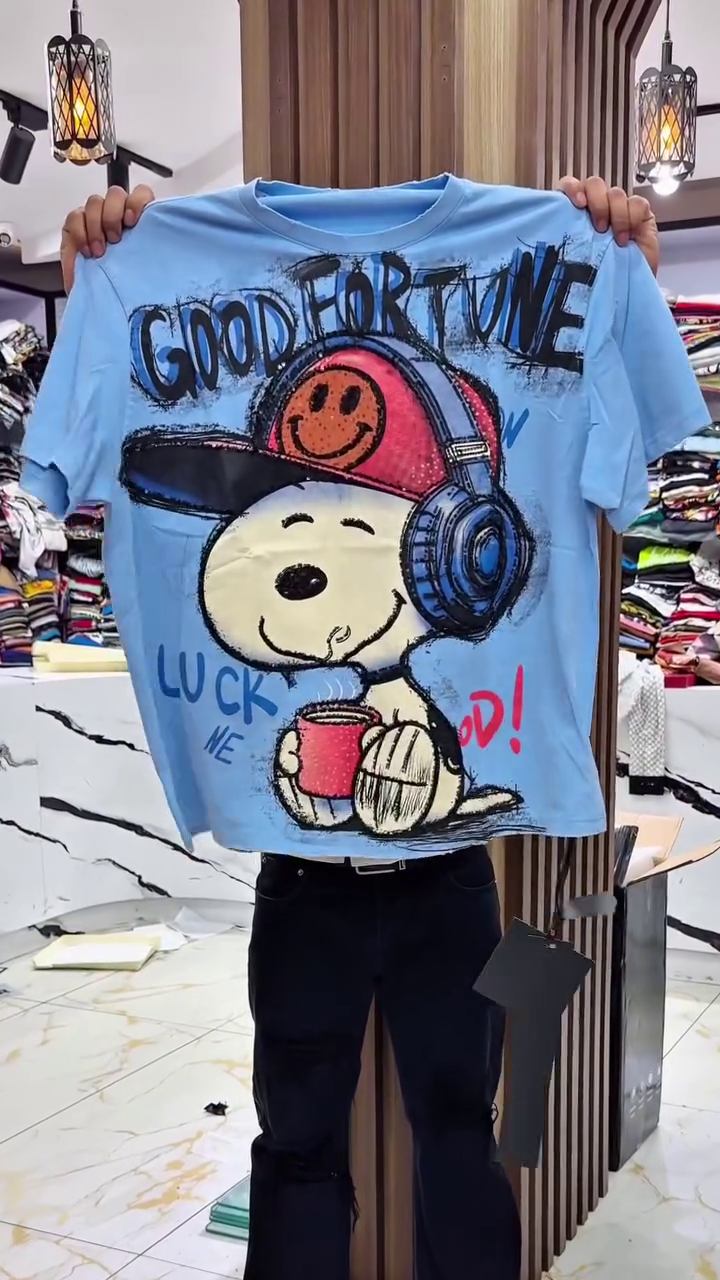 Playful Vibes: Light Blue Snoopy Graphic T-Shirt with “GOOD FORTUNE” Print