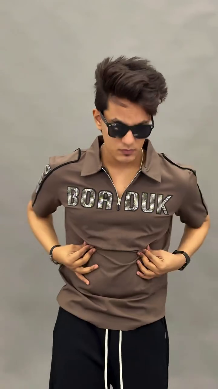 Sporty & Stylish: Green Polo Shirt with White Trim and Graphic Print