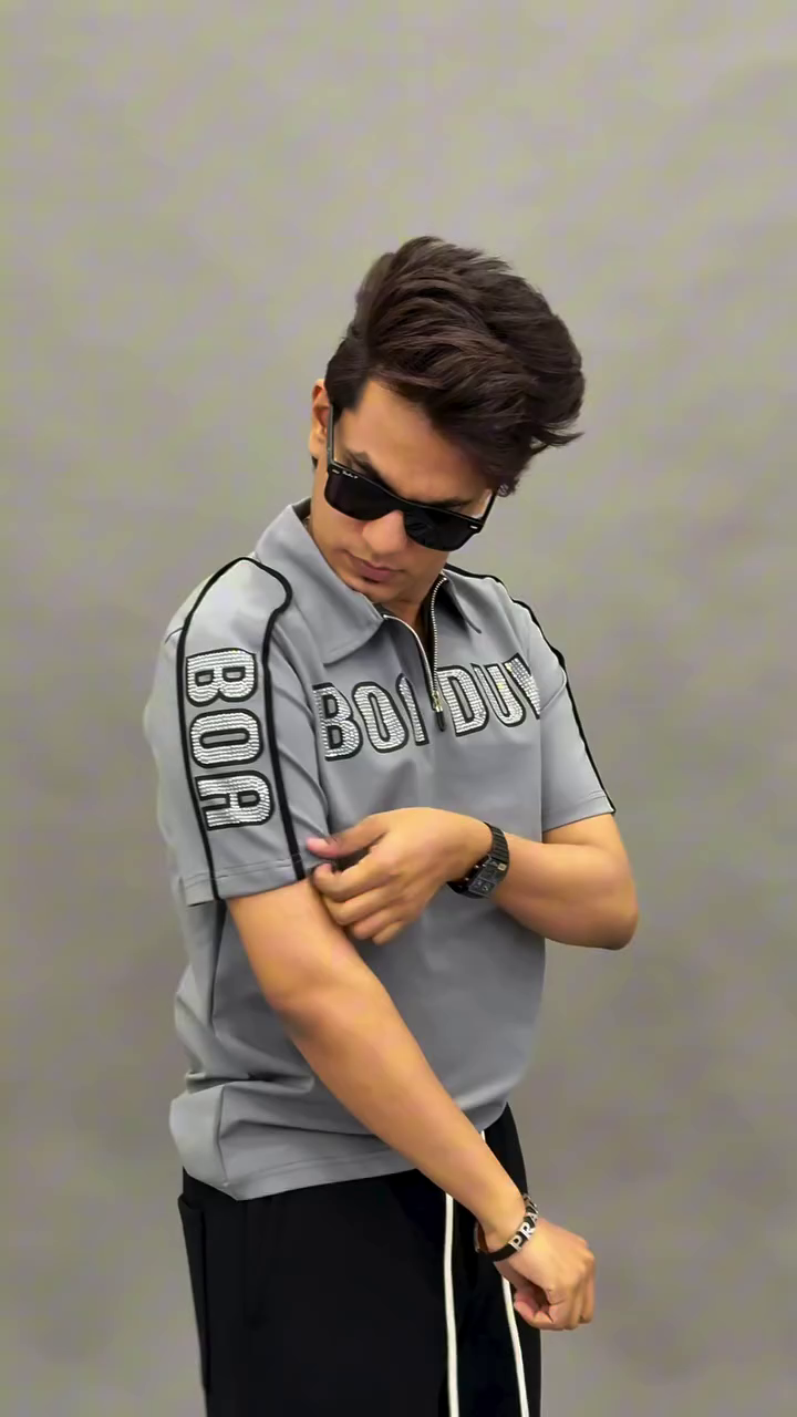 Sporty & Stylish: Green Polo Shirt with White Trim and Graphic Print