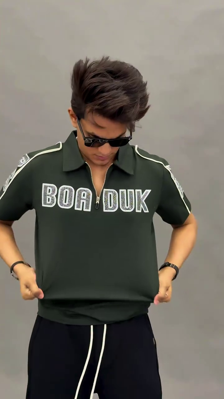 Sporty & Stylish: Green Polo Shirt with White Trim and Graphic Print