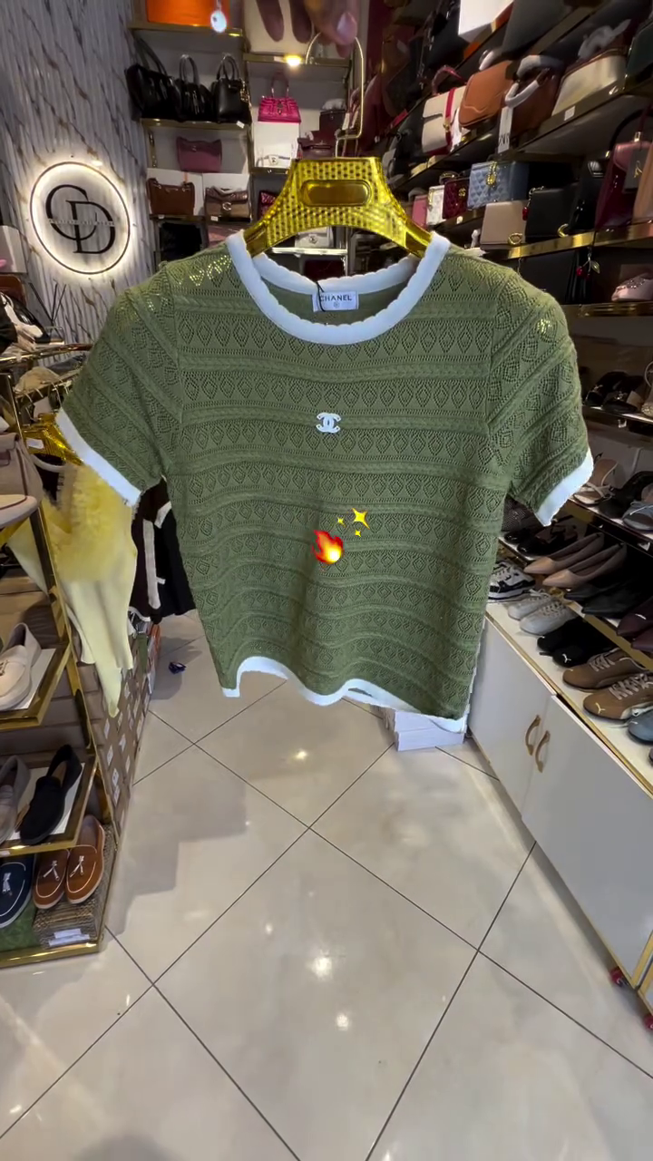 Chic Femininity: Pink Knit Top with Textured Pattern and Elegant White Trim