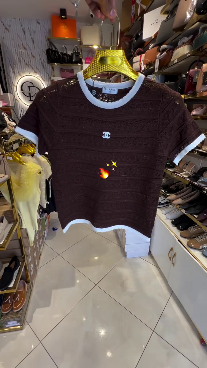 Chic Femininity: Pink Knit Top with Textured Pattern and Elegant White Trim