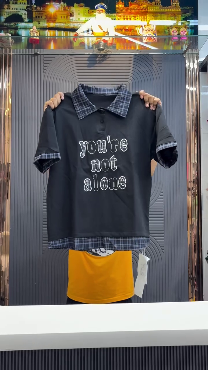 Clean Comfort with Meaning: White Polo-Style T-Shirt with Blue Striped Accents & “you’re not alone” Embroidery