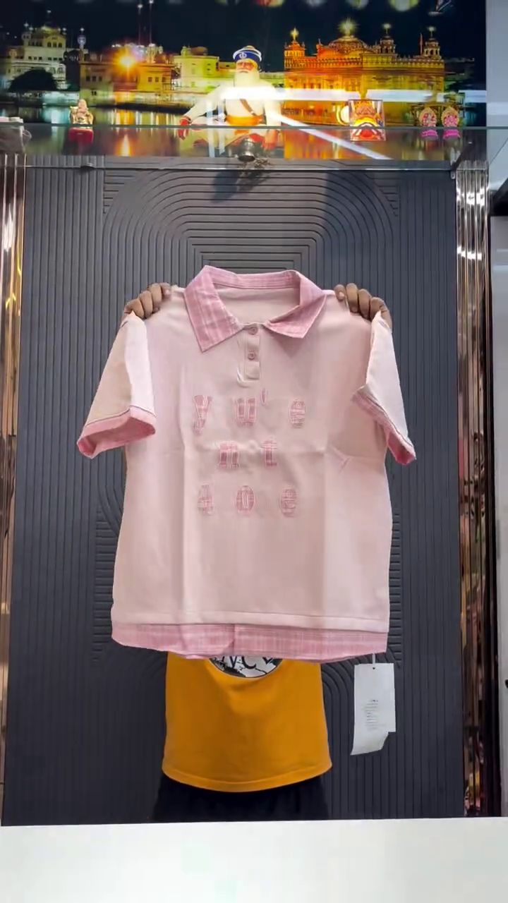 Clean Comfort with Meaning: White Polo-Style T-Shirt with Blue Striped Accents & “you’re not alone” Embroidery