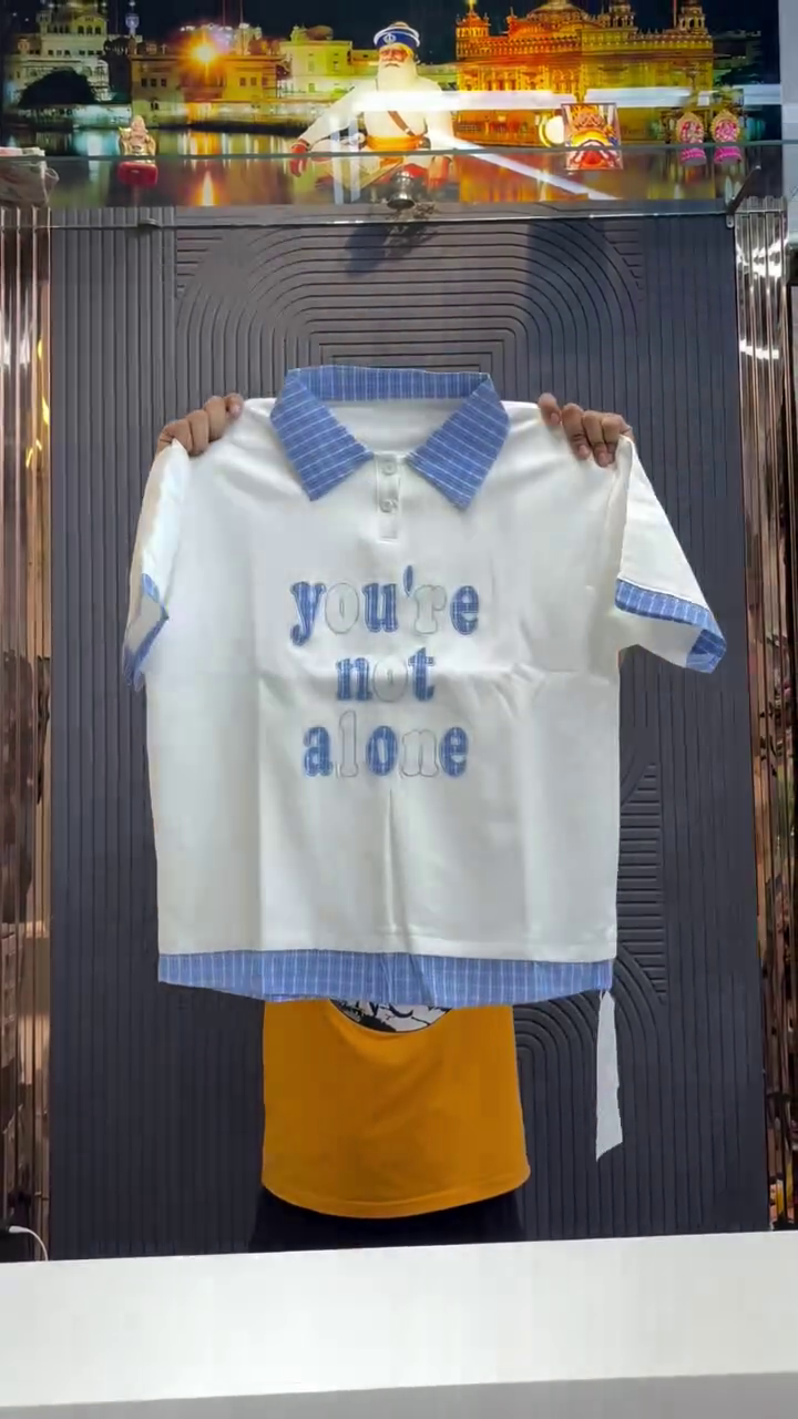 Clean Comfort with Meaning: White Polo-Style T-Shirt with Blue Striped Accents & “you’re not alone” Embroidery