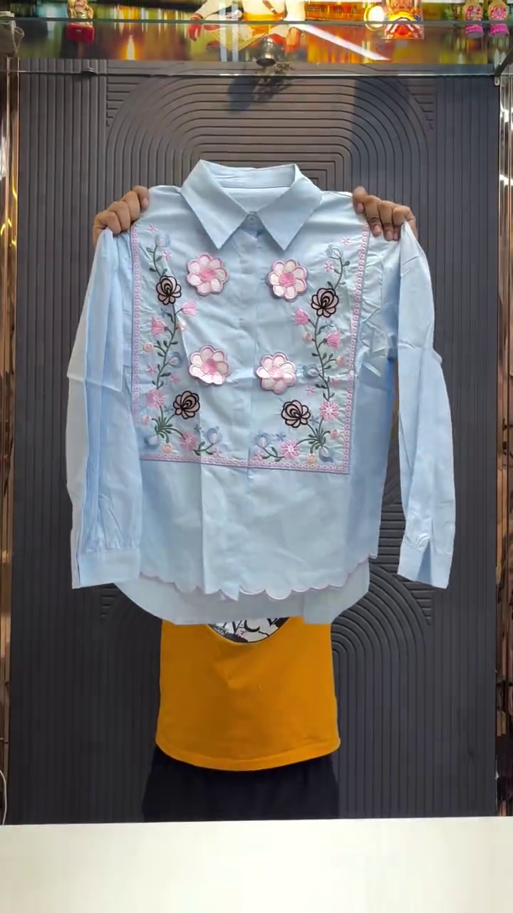 Elegant Statement Wear: Black Shirt with Vibrant Floral Embroidery