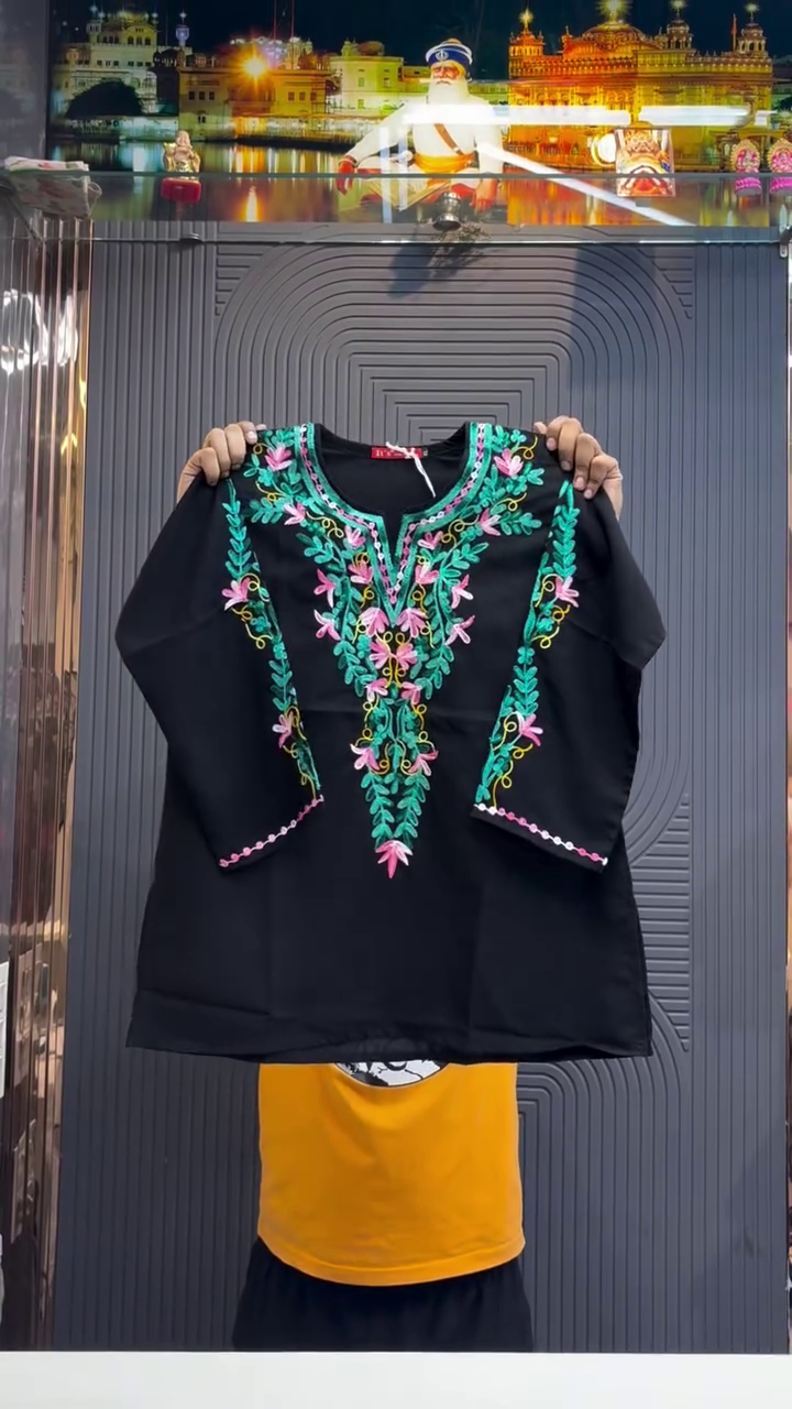 Elegant Ethnic Charm: Black Short Kurti with Intricate Floral Embroidery