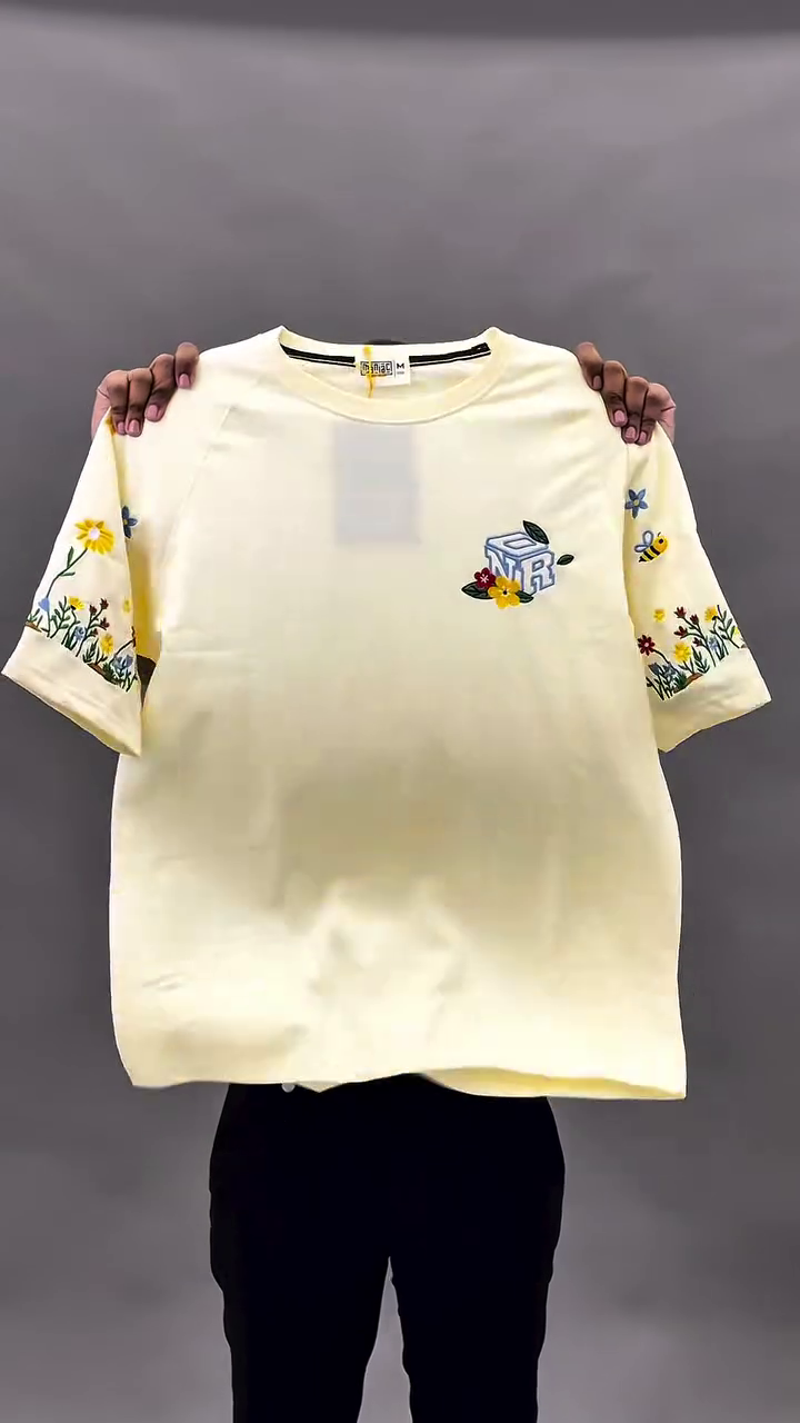 Bold & Bright Street Style: Yellow Oversized Graphic Tee with Floral Embroidered Sleeves