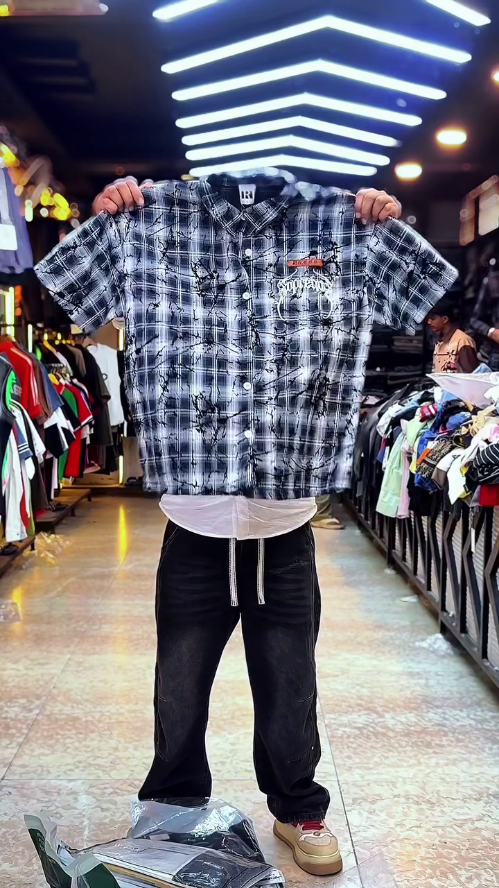 Edgy Street Casual: Red Plaid Checkered Shirt with Ink-Splatter & Graphic Branding