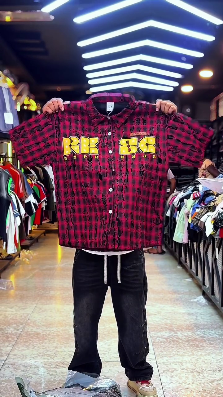 Edgy Street Casual: Red Plaid Checkered Shirt with Ink-Splatter & Graphic Branding