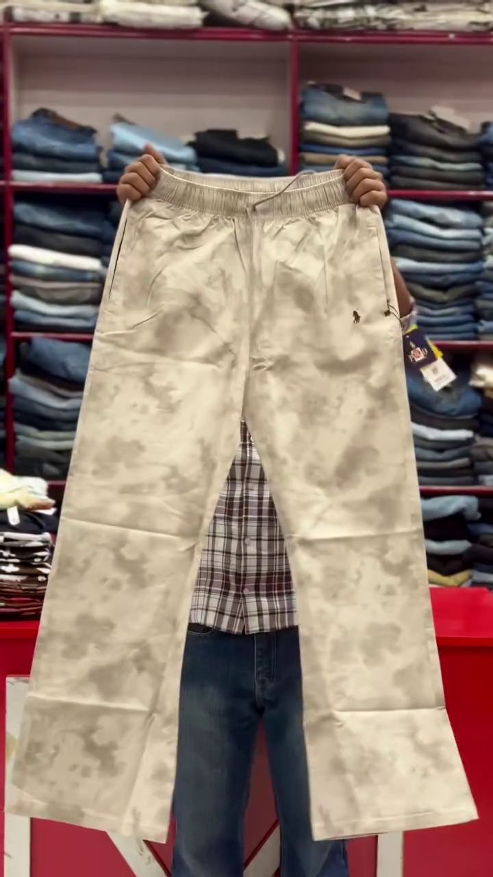 These white men's tie-dye trousers with a drawstring waist are categorized as casual wear or fashion pants.