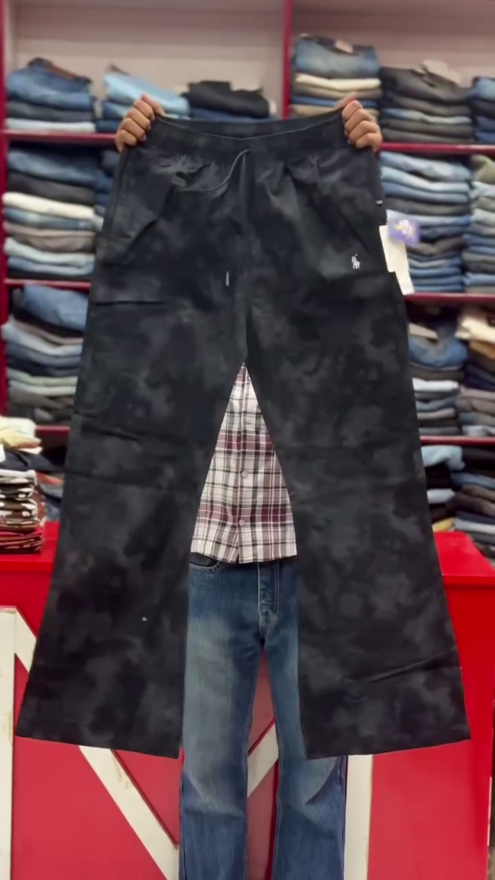 These white men's tie-dye trousers with a drawstring waist are categorized as casual wear or fashion pants.