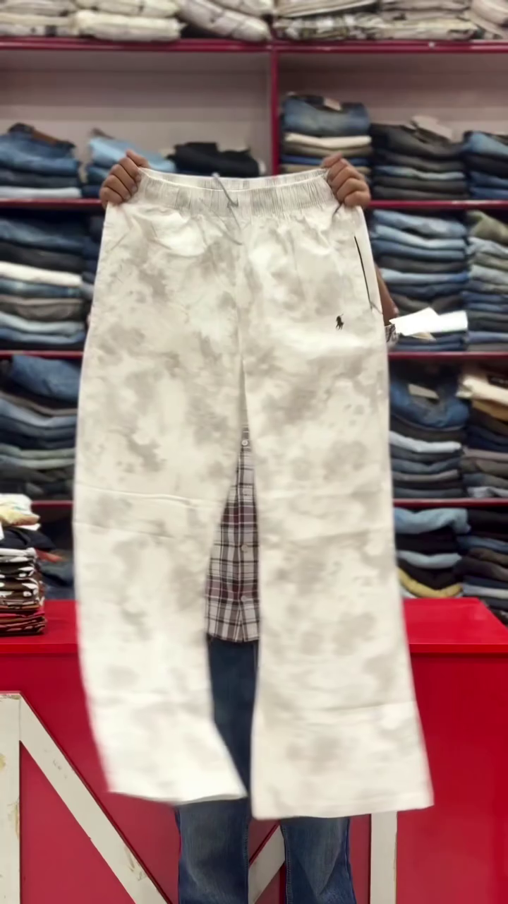 These white men's tie-dye trousers with a drawstring waist are categorized as casual wear or fashion pants.