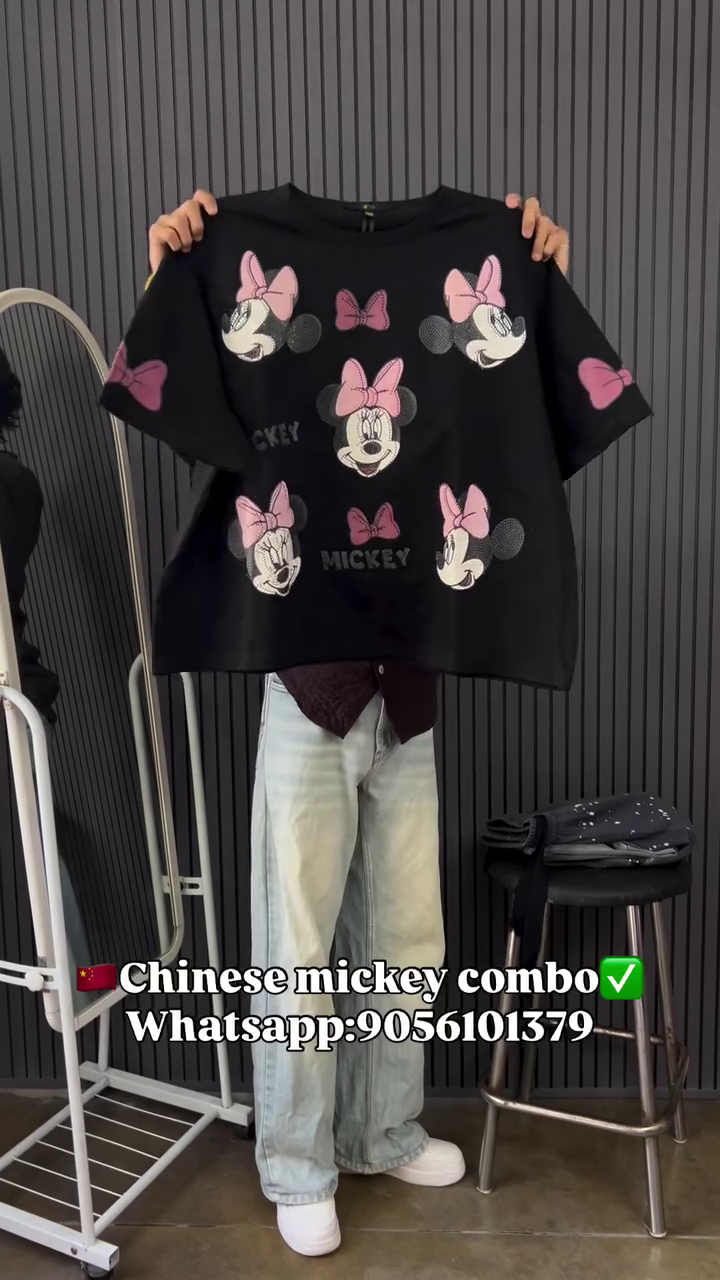 This image shows a black cotton oversized graphic t-shirt and trouser featuring multiple prints of the Disney character Minnie Mouse.