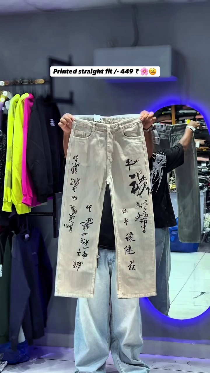 The item shown is a pair of printed straight-fit jeans