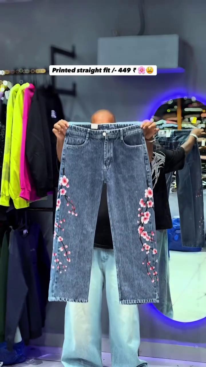 The item shown is a pair of printed straight-fit jeans